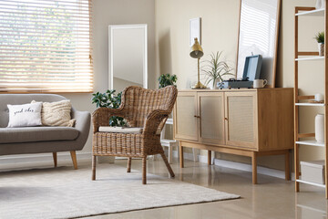 Interior of living room with sofa, armchair and commode