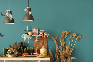 Interior of kitchen decorated for Halloween with counter and lamps