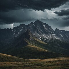 Fototapeta premium A storm brewing over a jagged mountain range.