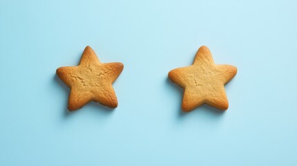 Single gingerbread star cookie on light pastel blue background
