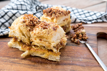 A slice of bread filled and topped with a smooth, rich nut nougat cream. The creamy filling and topping add a delightful, indulgent touch to the bread, creating a tempting treat