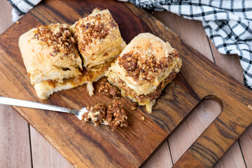 A slice of bread filled and topped with a smooth, rich nut nougat cream. The creamy filling and topping add a delightful, indulgent touch to the bread, creating a tempting treat