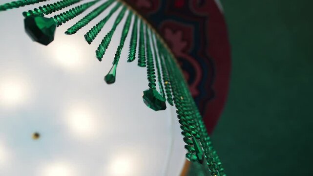 Tatar decorative pendant made of beads strung on threads. Multi-colored ornament symbolizes cultural and historical people peculiarity
