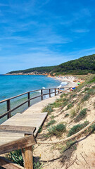 Boardwalk to reach the beach of San Adeodato. Cove in the small village of Sant Tomas, Alaior, Menorca, Balearic Islands, Spain.