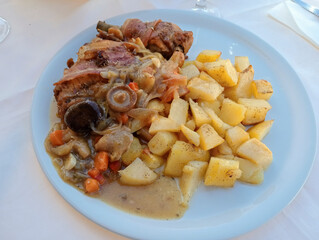 A meat stew with potatoes and vegetables typical of Mediterranean cuisine