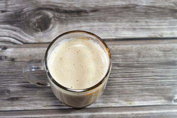 A mug of cappuccino topped with creamy froth, an espresso-based coffee drink that is traditionally prepared with steamed milk foam micro foam, The name comes from the Capuchin friars, selective focus