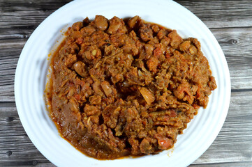 Egyptian fava beans with beef meat sausage, the main dish, sandwich in the breakfast in Egypt, cooked with crushed bean, yellow lentils and wheat, Fava beans main dish of Suhor in Ramadan