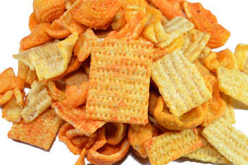 Traditional savory snacks mix, with assorted flavors of ketchup, salt, sweet chili, crackers mixture, assorted snack with various shapes and flavor, selective focus