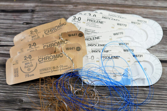 Cairo, Egypt, October 13 2024: Surgical sutures of ETHICON Prolene blue color suture 3-0 Polypropylene non absorbable and Chromic surgical gut sutures, catgut absorbable suture, selective focus