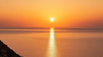 Fototapeta premium Travel image showing the orange sky of the sunset over the sea