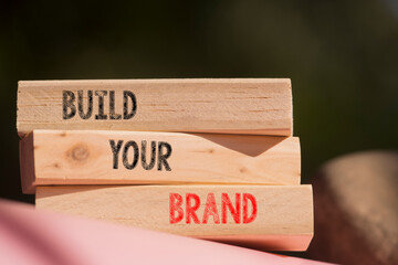 Build your Brand symbol. Concept words Build your Brand on wooden blocks. Beautiful blurry background. Business and Build your Brand concept. Copy space