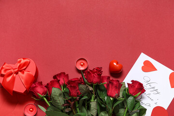 Composition with rose flowers, gift box and card for Valentine's Day celebration on red background