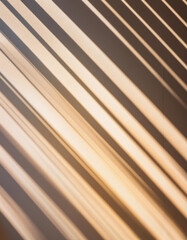 Obraz premium Abstract Golden Hour Shadows of Window Blinds on a Smooth White Wall
