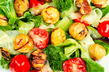 Green salad with tomato and seasonal herbs and roasted chestnuts.