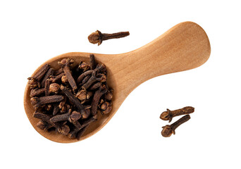 Whole clove buds in a wooden spoon cutout macro. Spoon full of dry organic cloves spice isolated on...