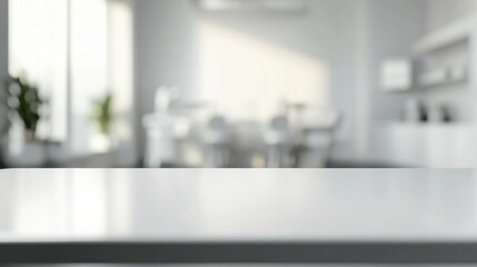 Empty table surface in sharp focus with a blurred white dental clinic room featuring modern equipment in the background.