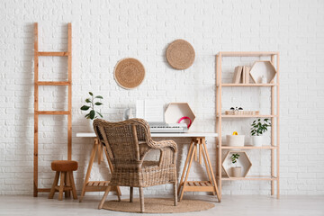 Interior of living room with synthesizer, ladder and shelf unit