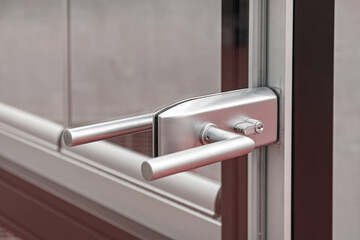 Modern Handle With Lock at Glass Door Building Entrance