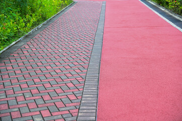 Obraz premium Close-up of the jogging track in the public park in Hong Kong. Public park scene, healthy activity.