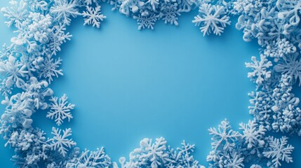 Winter wonderland! Frosty snowflakes arranged on a bright blue background.
