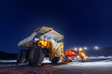 Process of refueling quarry dump truck before night shift in quarry ore