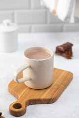 Mug of sweet hot chocolate with small bars and anise star