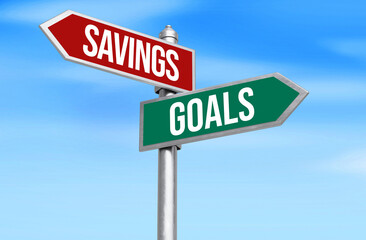 Fototapeta premium Savings Vs Goals on 3d rendered signboard typography with blue sky in the backdrop. Future goals and savings for good financial life concept, background