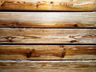 Naklejka premium Warm wooden planks with natural grain patterns create inviting texture for design use