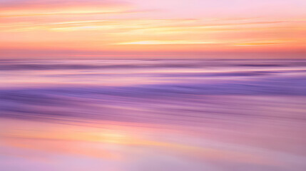 Obraz premium Dreamy Beach Sunset with Gentle Waves Reflecting Golden and Lavender Hues