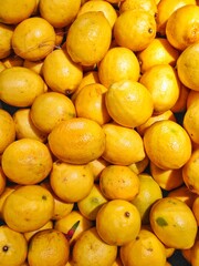 Top view stack of fresh lemons, Ripe Yellow Lemon Background Or Texture.