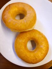Original homemade potato donuts on white plate. Can be used for food menu photos.