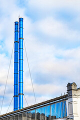 blue pipes of the city boiler house. boiler room with smokeless pipes. vertical photo