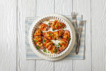 hot sausages baked with cheese, tomato, mustard