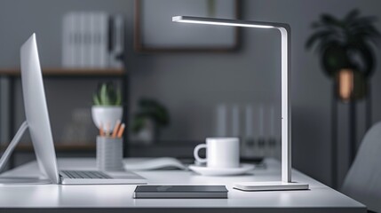 Modern desk lamp illuminates a workspace at night.