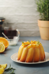 A sweet citrus cake served with oranges and lemons	