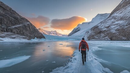 Fototapeta premium Adventurous Hiker Walking Along Icy Glacier in Arctic Landscape