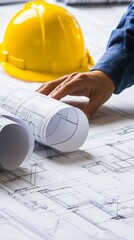 Architect reviewing blueprints.
