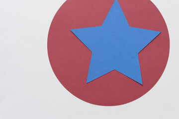 blue star on red circle and blank paper