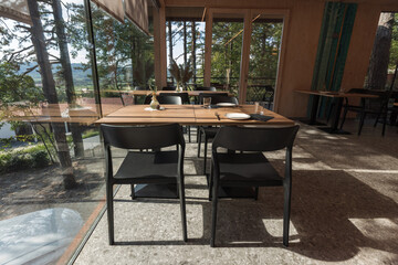 Glamping hut with restaurant in forest.