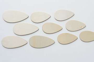 laser-cut wooden streamlined shapes arranged on blank paper