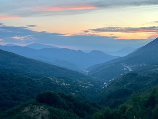 Fototapeta premium mountains and clouds and sunset