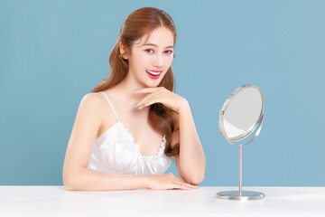 Pretty Asian beauty woman curly long hair with Korean makeup glowing face and healthy facial skin...