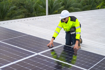 Men technicians mounting photovoltaic solar moduls on roof of house.