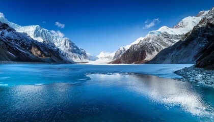 Obraz premium icy blue landscape featuring a serene lake and majestic mountains, wrapped in cool tones