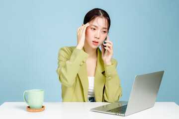 Young disappointed troubled confused employee business woman in casual suit sit work at white...