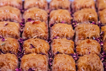 Baclava layered pastry dessert made of filo pastry, filled with chopped nuts, and sweetened with syrup or honey. Baclava or pakhlava the sweet pastries of Ottoman, Arabian, Persian and Greek cuisine