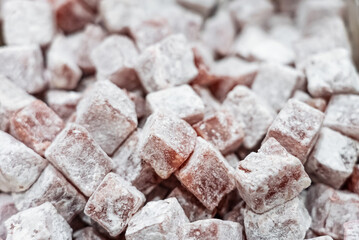 Turkish delight or lokum, halgoum is a family of confections with starch and sugar. Premium turkish delight. Famous turkish and greek sweet dessert. Turkish delight close up shot of colorful sweets.