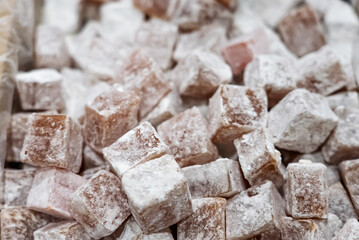 Turkish delight or lokum, halgoum is a family of confections with starch and sugar. Premium turkish delight. Famous turkish and greek sweet dessert. Turkish delight close up shot of colorful sweets.