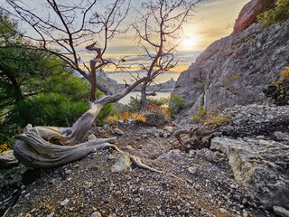 Dangerous off road driving along mountain edge and steep cliffs.