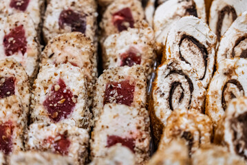 Turkish delight or lokum, halgoum is a family of confections with starch and sugar. Premium turkish delight. Famous turkish and greek sweet dessert. Turkish delight close up shot of colorful sweets.